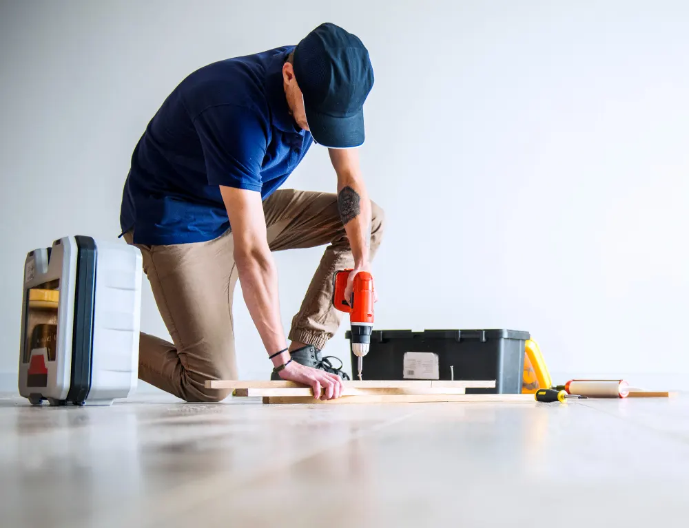 Handyman in Dubai mounting a fixture — EnergiaWorks